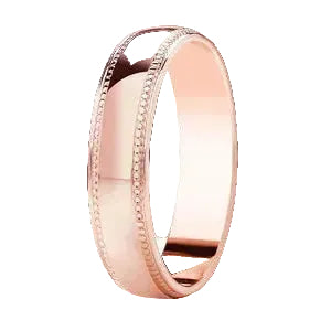 Rose gold ring with milgrain detailing on a white background