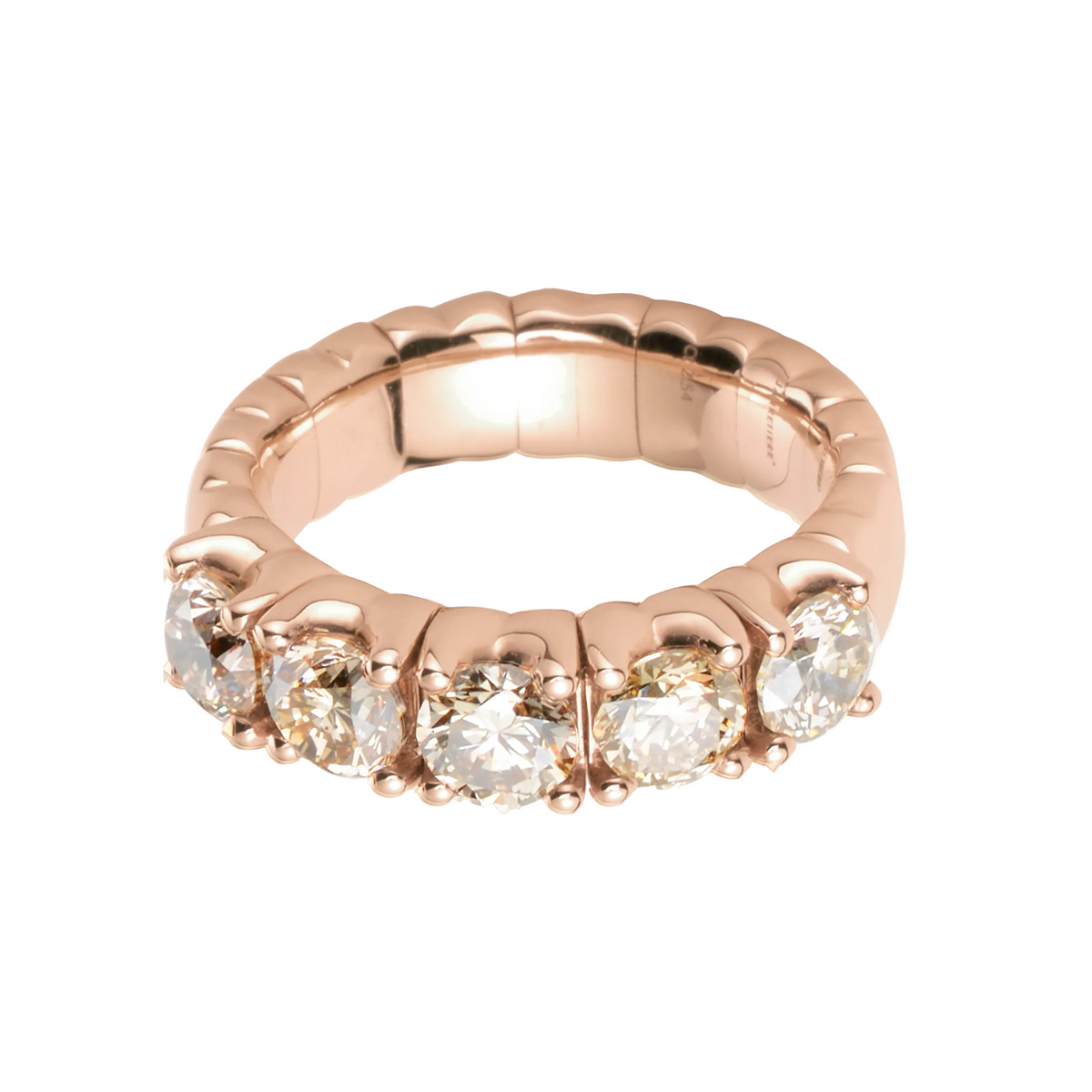 Rose gold ring with embedded diamonds on a white background