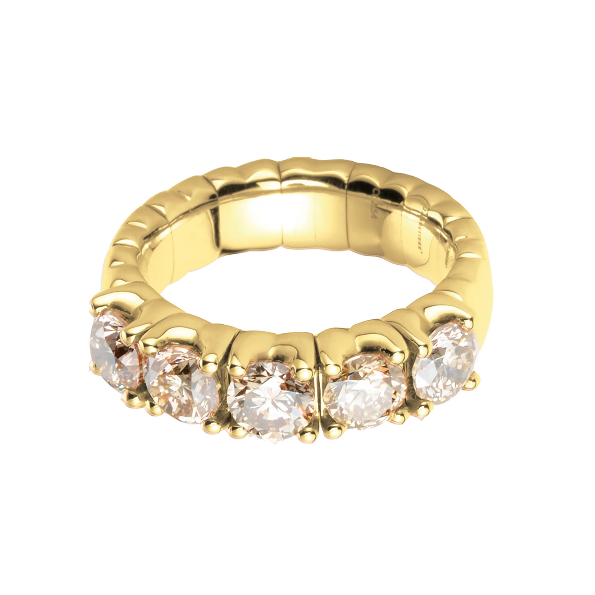 Gold ring with embedded diamonds on a white background