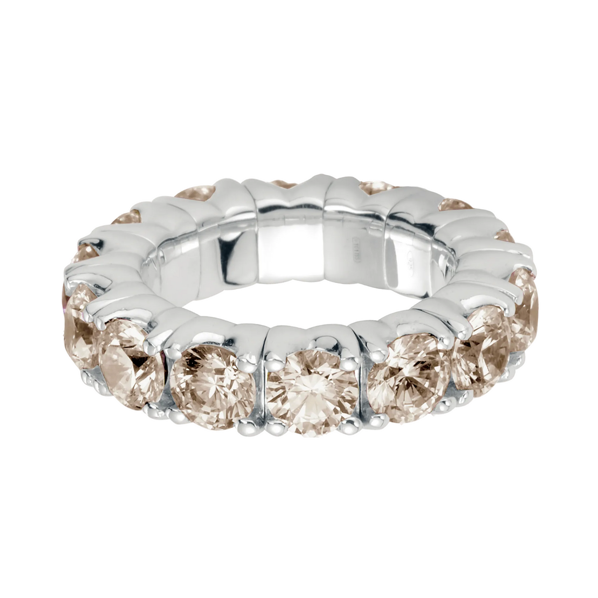 Silver ring with four round champagne gemstones on a white background