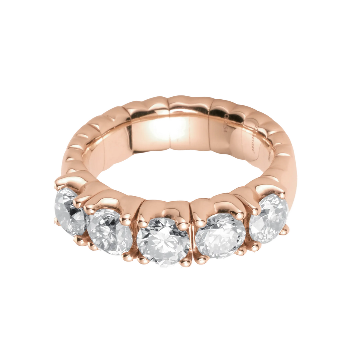 Rose gold ring with five diamonds on a white background