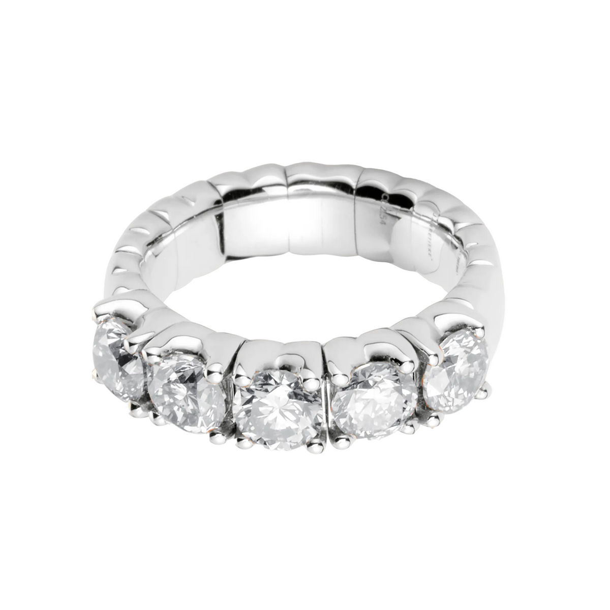 Silver ring with clear gemstones on a white background