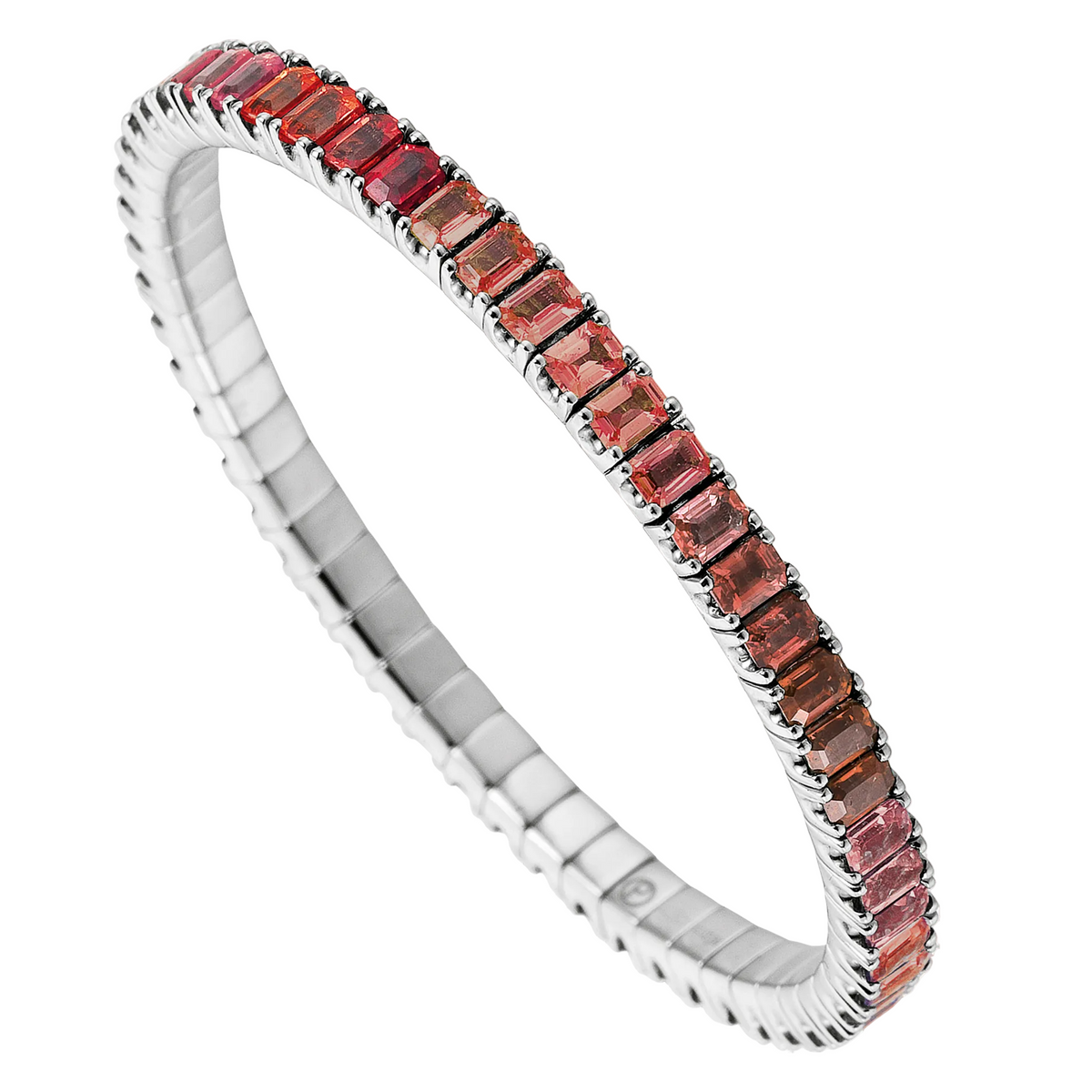 Silver bracelet with red gemstones on a white background