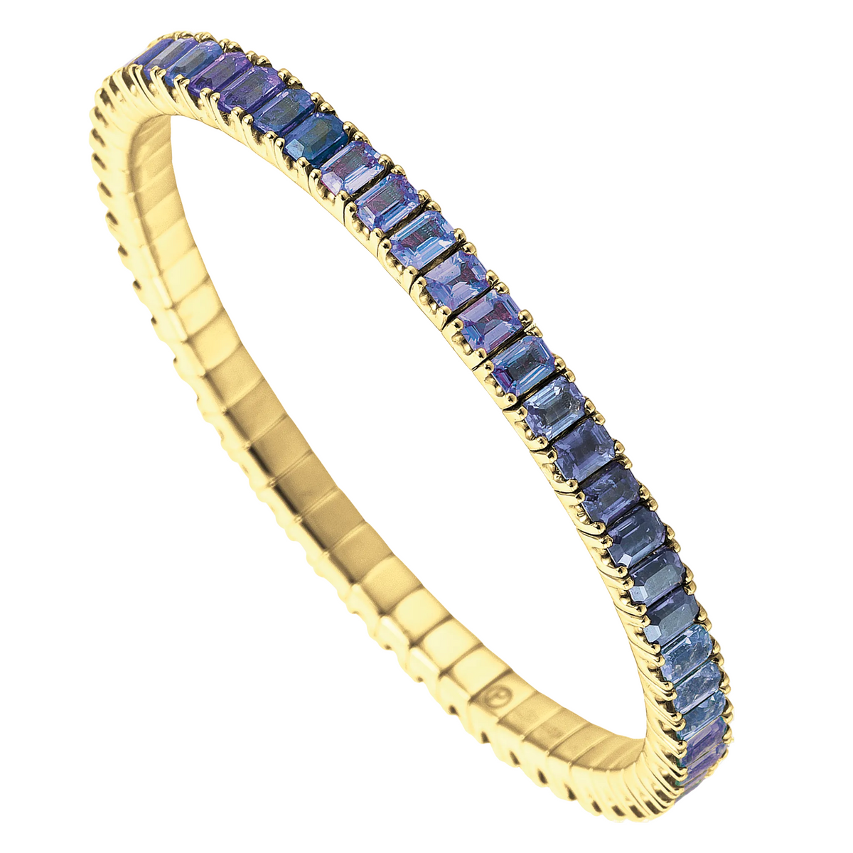 Gold tennis bracelet with blue gemstones on a white background