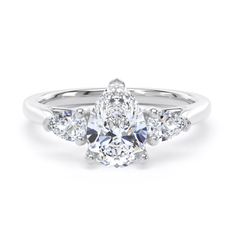 Diamond ring with a pear-shaped center stone on a white background