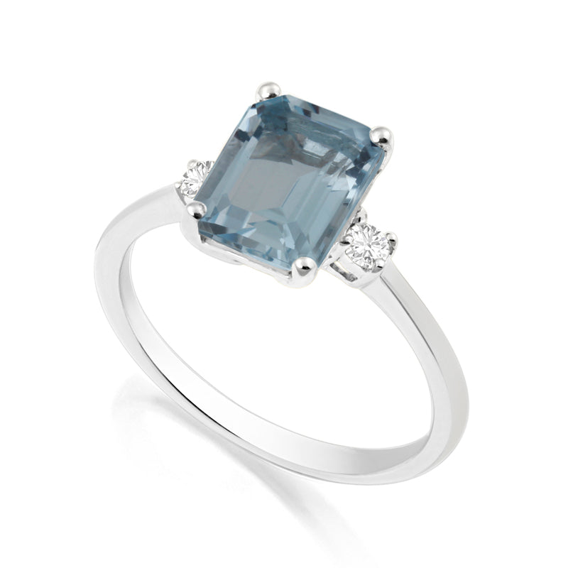 Elongated Radiant Cut Blue Topaz White Gold Trilogy Ring with Diamond Sidestones