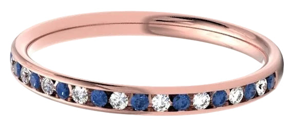 A rose gold eternity ring featuring a channel-set row of alternating deep blue sapphires and clear round-cut stones, shown on a clean white background.