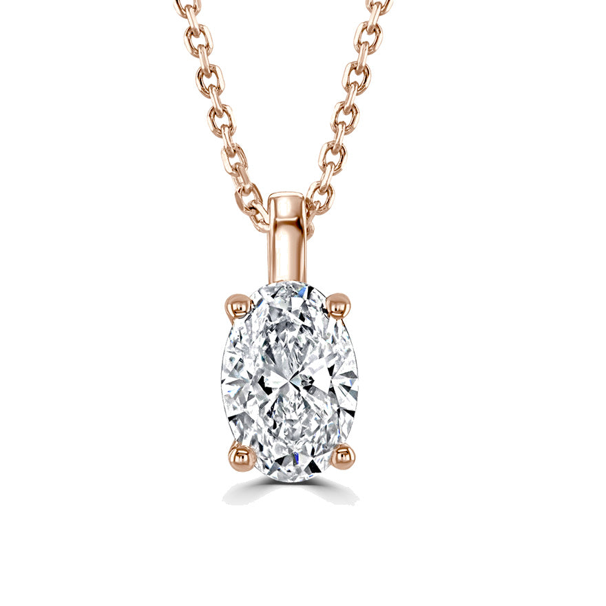 A rose gold pendant necklace featuring an oval-cut clear gemstone in a four-prong setting, suspended from a matching rose gold chain against a solid white background.