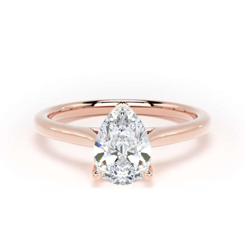 A pear-cut diamond engagement ring in a polished rose gold band, centered on a clean white background.