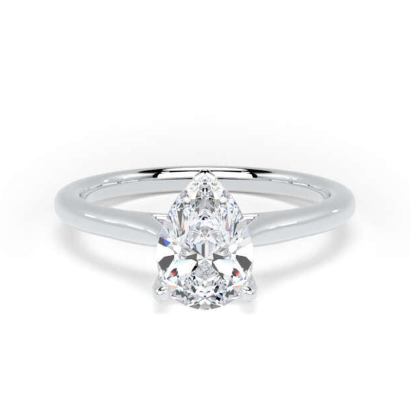 A silver solitaire engagement ring featuring a pear-cut diamond center stone in a four-prong setting, shown on a clean white background.
