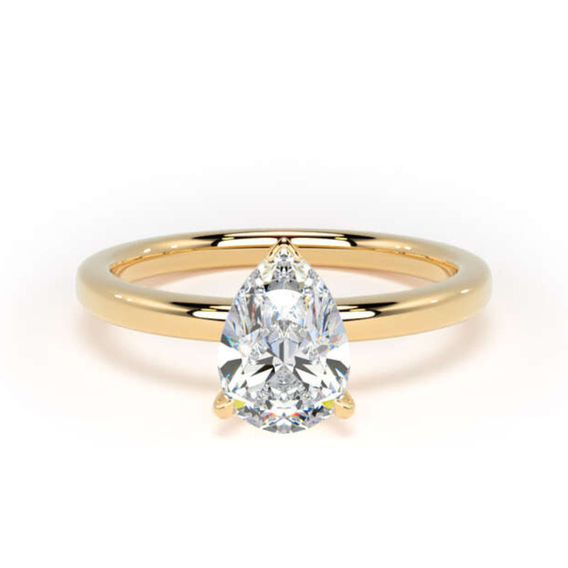 A pear-cut diamond engagement ring with a polished yellow gold band, shown on a clean white background.