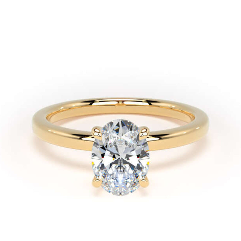 A yellow gold solitaire engagement ring featuring a round brilliant-cut diamond center stone in a four-prong setting, shown on a clean white background.