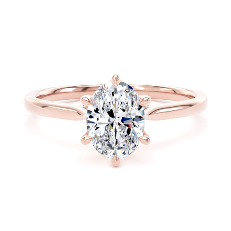 An oval-cut diamond engagement ring in a rose gold six-prong setting on a clean white background.