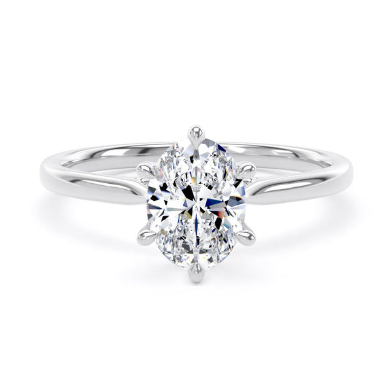 An oval-cut diamond engagement ring with a polished silver-colored band, set against a clean white background.