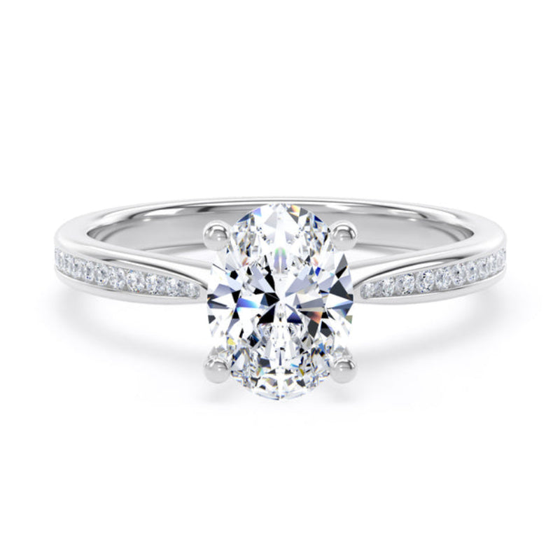 An oval-cut diamond engagement ring with a brilliant solitaire center stone and a split shank paved with small round diamonds, set in a polished silver-colored metal on a white background.