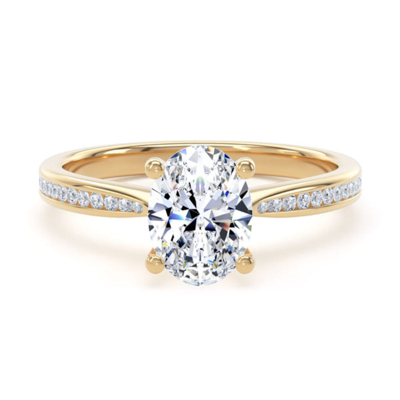 A yellow gold engagement ring featuring a large oval-cut center stone in a four-prong setting, with a pavé diamond split band, shown on a solid white background.