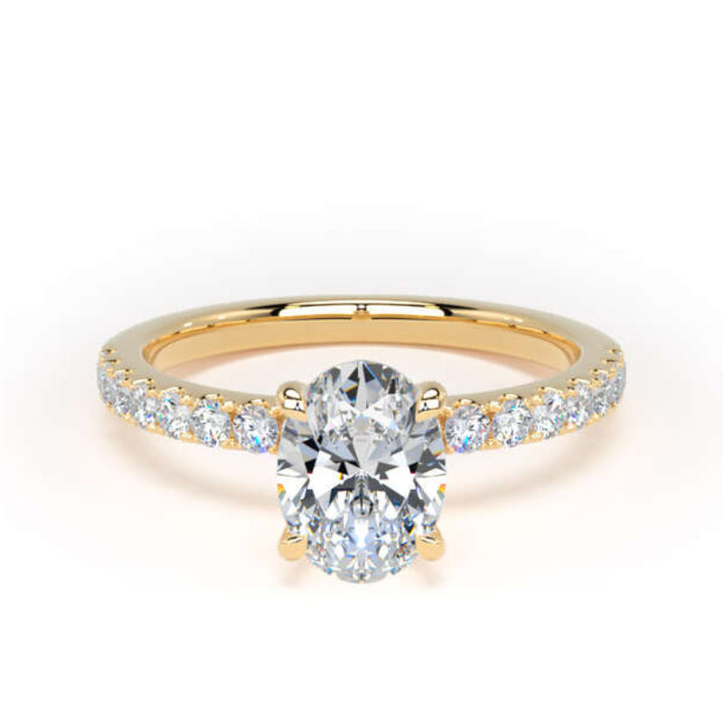 A yellow gold engagement ring featuring a round brilliant-cut center diamond and a pavé-set row of small diamonds along the band, shown on a clean white background.