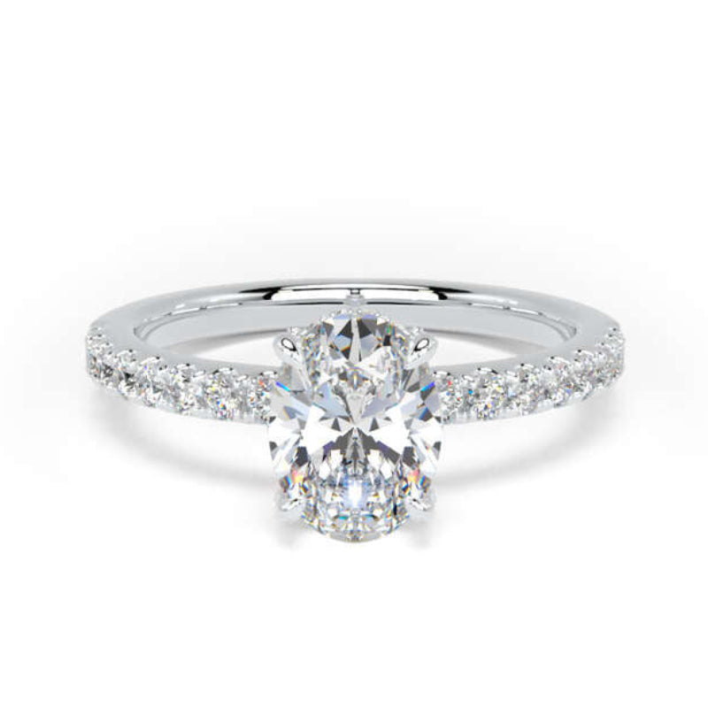A radiant cut diamond engagement ring with a pavé band in white gold or platinum, shown on a clean white background.
