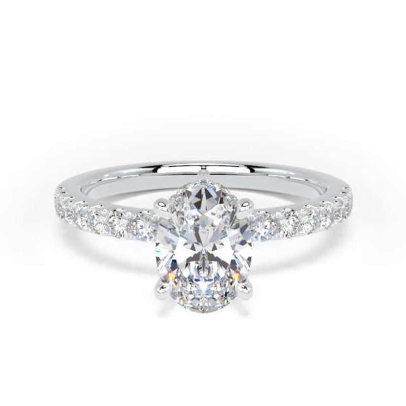 A silver diamond ring with a marquise-cut center stone and a pavé band, shown on a plain white background.