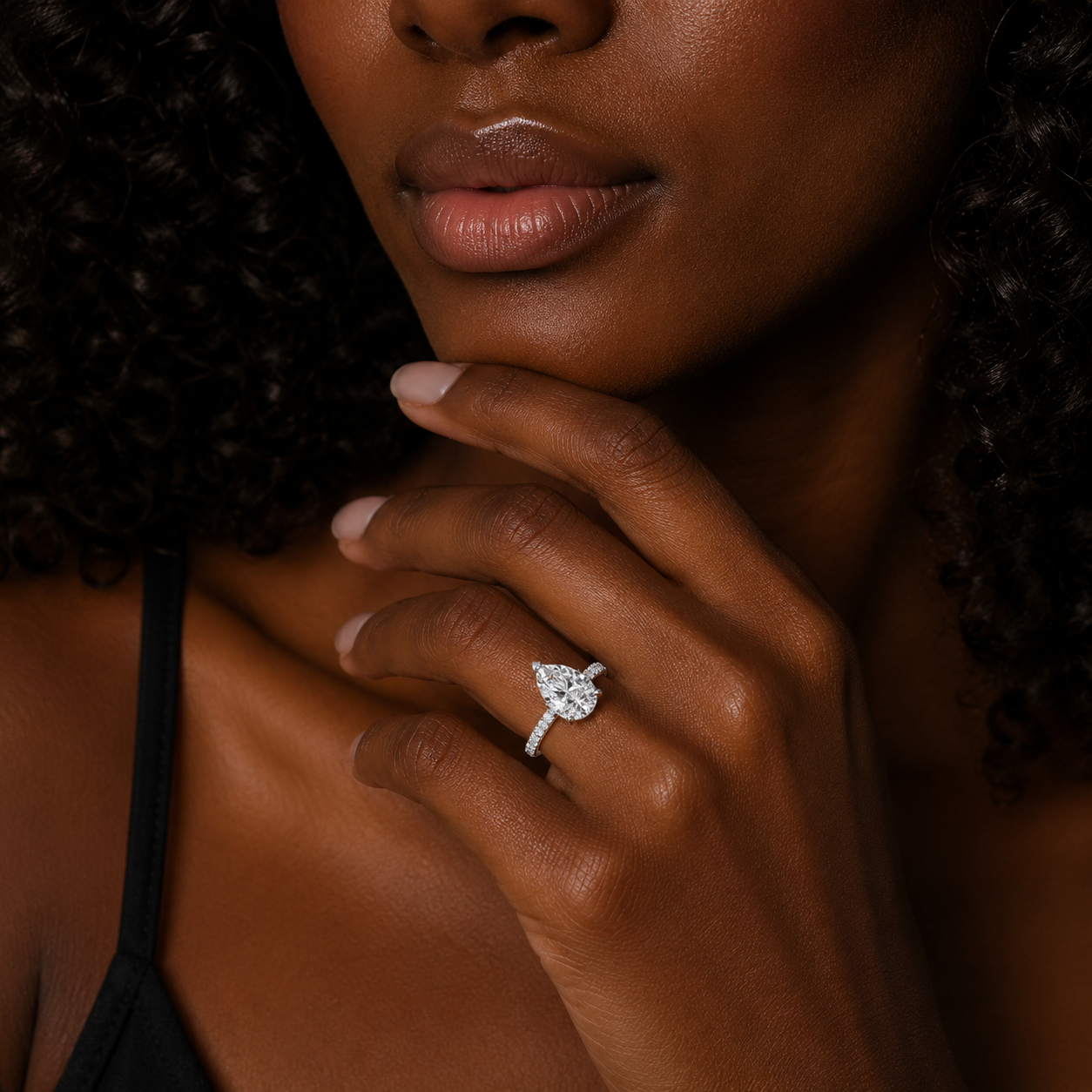 Close-up of a woman's hand wearing a diamond ring