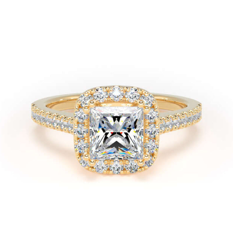 A yellow gold halo ring featuring a large cushion-cut diamond center stone surrounded by a halo of smaller diamonds, with the band also paved with diamonds, set against a plain white background.