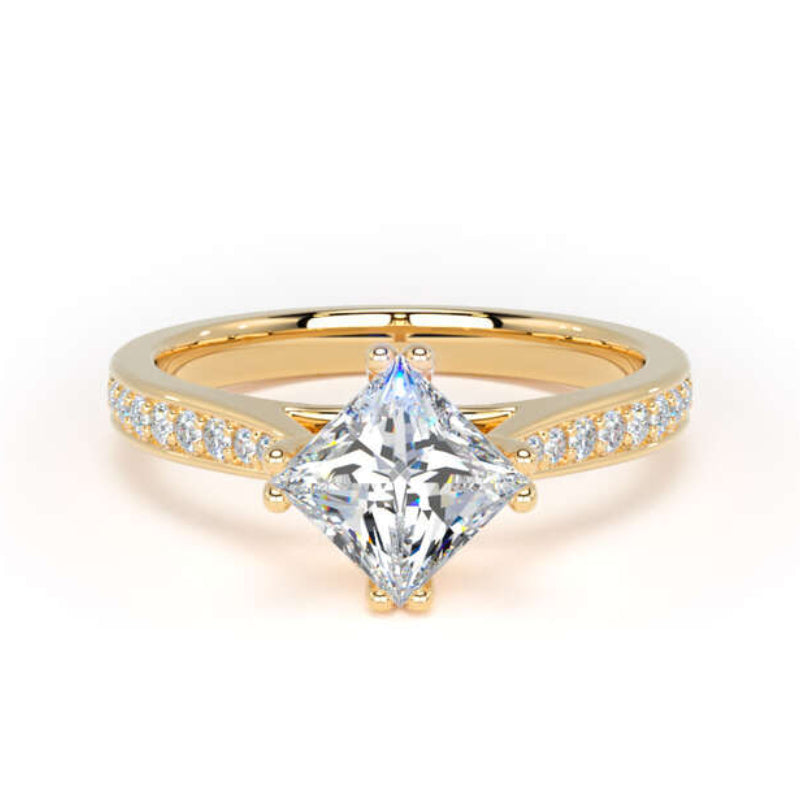 A yellow gold ring featuring a large princess-cut clear center stone and a pavé-set diamond band, shown on a clean white background.