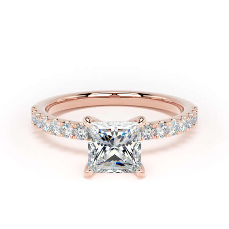 A rose gold engagement ring featuring a princess-cut center diamond and a pavé band with small round diamonds, set against a plain white background.