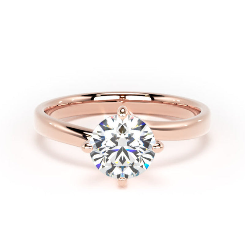 A rose gold solitaire engagement ring with a round brilliant-cut clear gemstone, set in a four-prong setting on a polished band, shown against a plain white background.