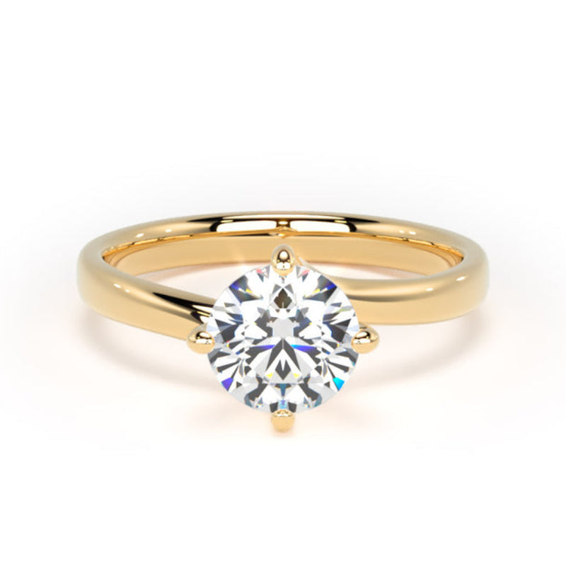A classic solitaire engagement ring featuring a round brilliant-cut clear gemstone in a four-prong setting on a polished yellow gold band, set against a seamless white background.