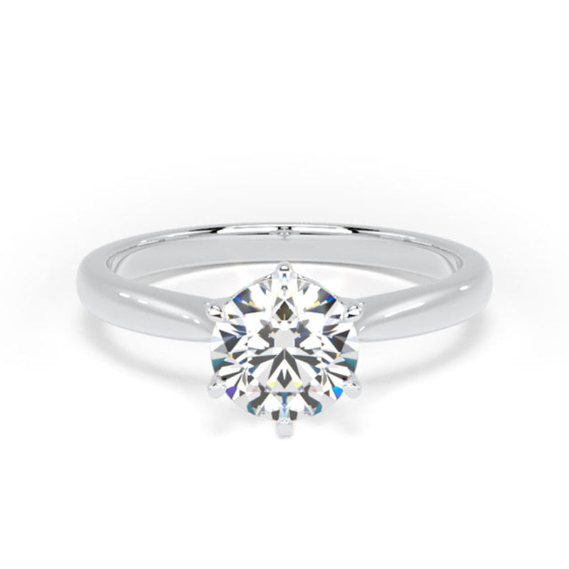 A classic solitaire engagement ring featuring a round brilliant-cut diamond set in a polished white gold or platinum band, shown on a clean white background.