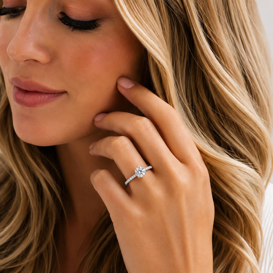 Close-up of a woman wearing a diamond ring on her hand with a blurred background