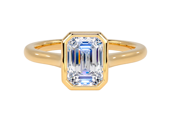 A yellow gold ring featuring a rectangular emerald-cut clear gemstone, set against a clean white background.