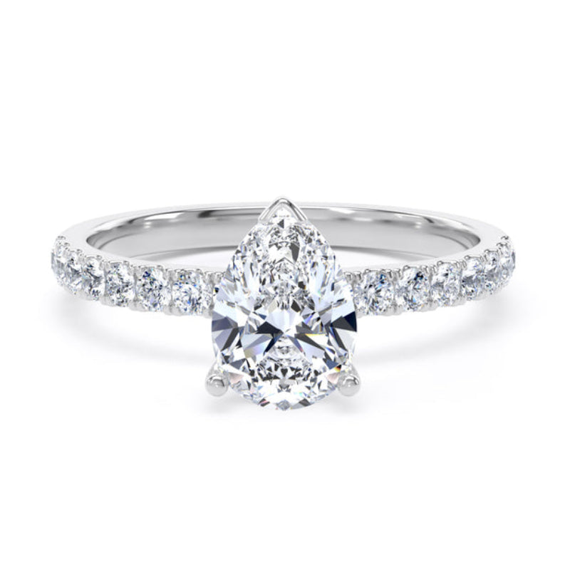 Diamond ring with a pear-shaped center stone on a white background
