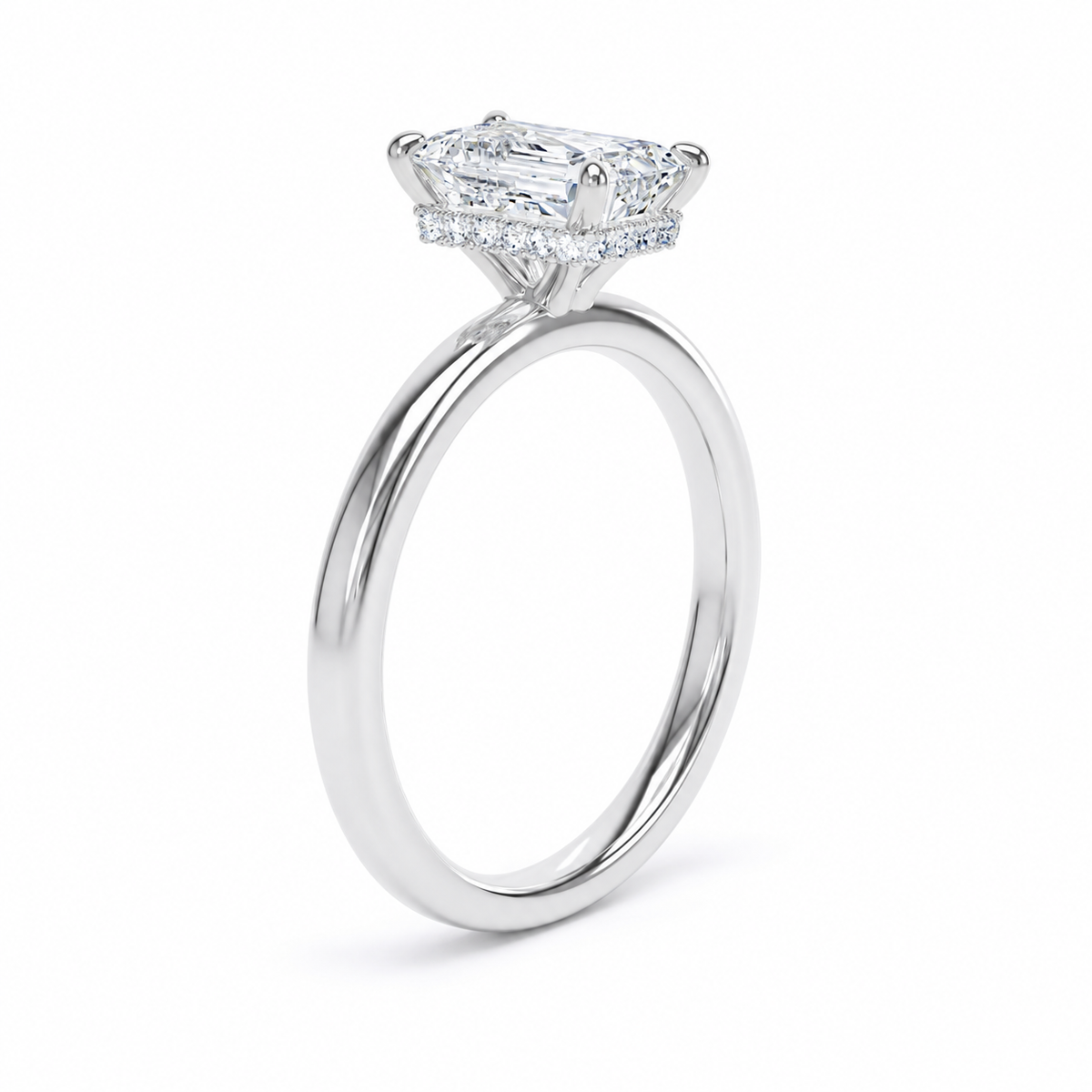 A silver-toned diamond ring featuring a rectangular radiant-cut center stone and a halo of smaller round diamonds, shown on a clean white background.