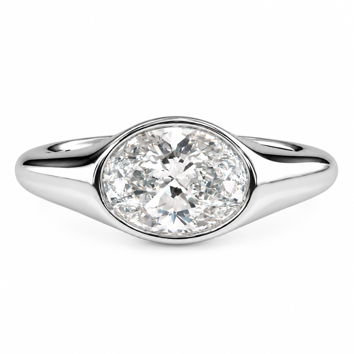 A silver oval diamond ring with a brilliant oval-cut center stone and a polished silver band, shown on a clean white background.