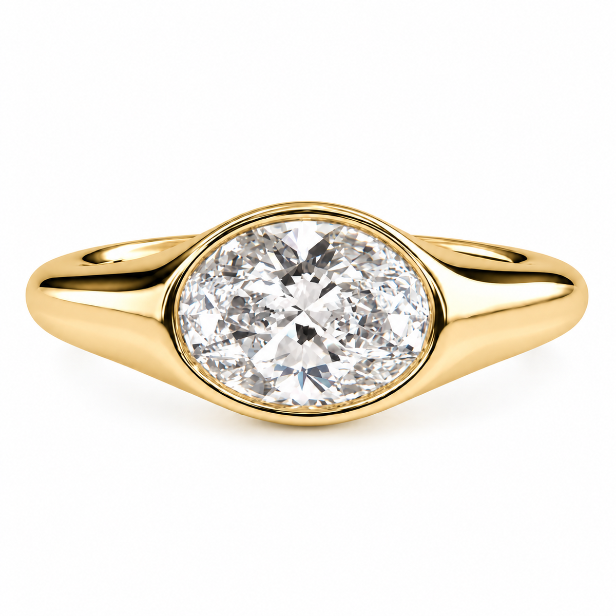 A yellow gold oval ring featuring a large, oval brilliant-cut diamond center stone in a bezel setting, shown against a plain white background.