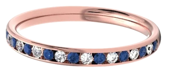 A rose gold eternity ring featuring a channel-set row of dark blue sapphires and clear round-cut stones, shown on a clean white background.