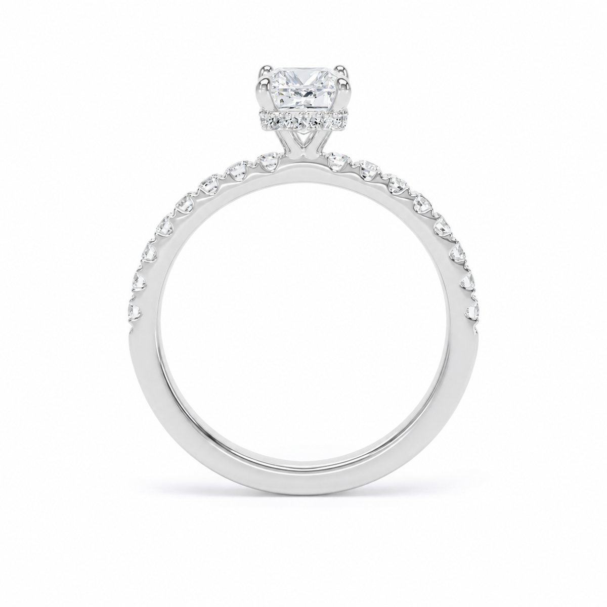A white gold or platinum hidden halo engagement ring with a radiant-cut center stone and a halo of small round stones, shown on a clean white background.
