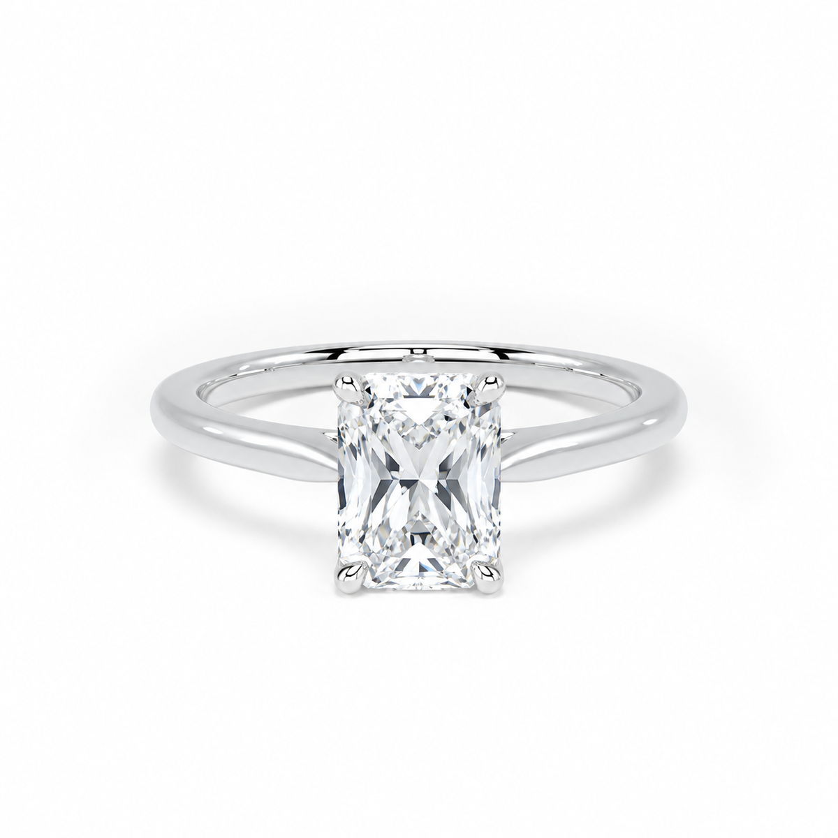 A radiant-cut diamond engagement ring with a polished silver-colored band, shown on a clean white background.