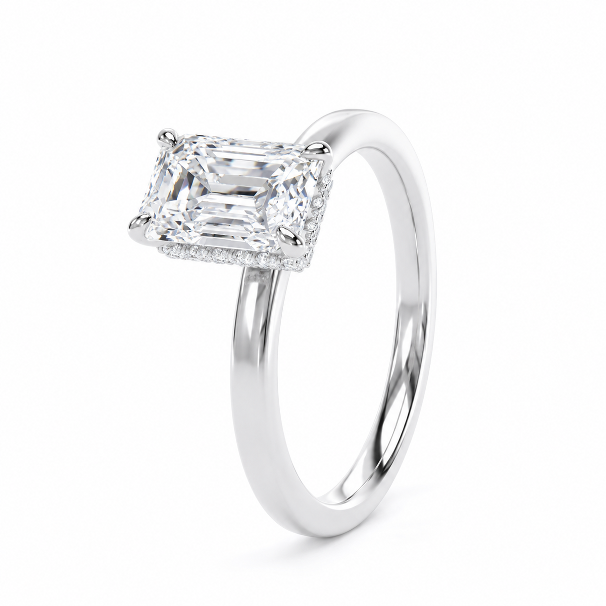 An radiant-cut diamond engagement ring in a polished white gold or platinum band, set against a clean white background.