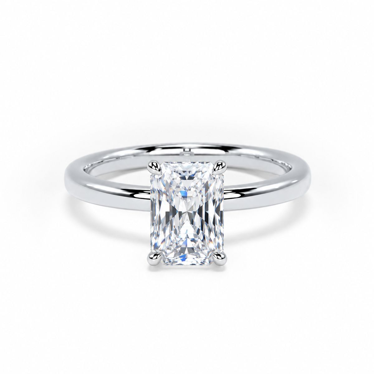 A radiant cut diamond engagement ring with a polished silver-colored band, shown on a clean white background.