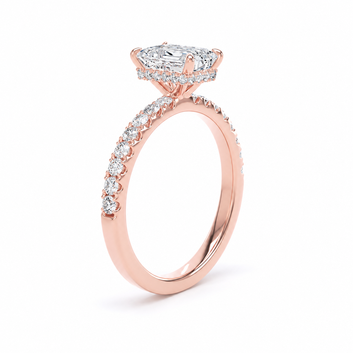 A rose gold engagement ring featuring a large radiant-cut diamond center stone and a halo of smaller diamonds, with a pavé-set diamond band, shown on a clean white background.