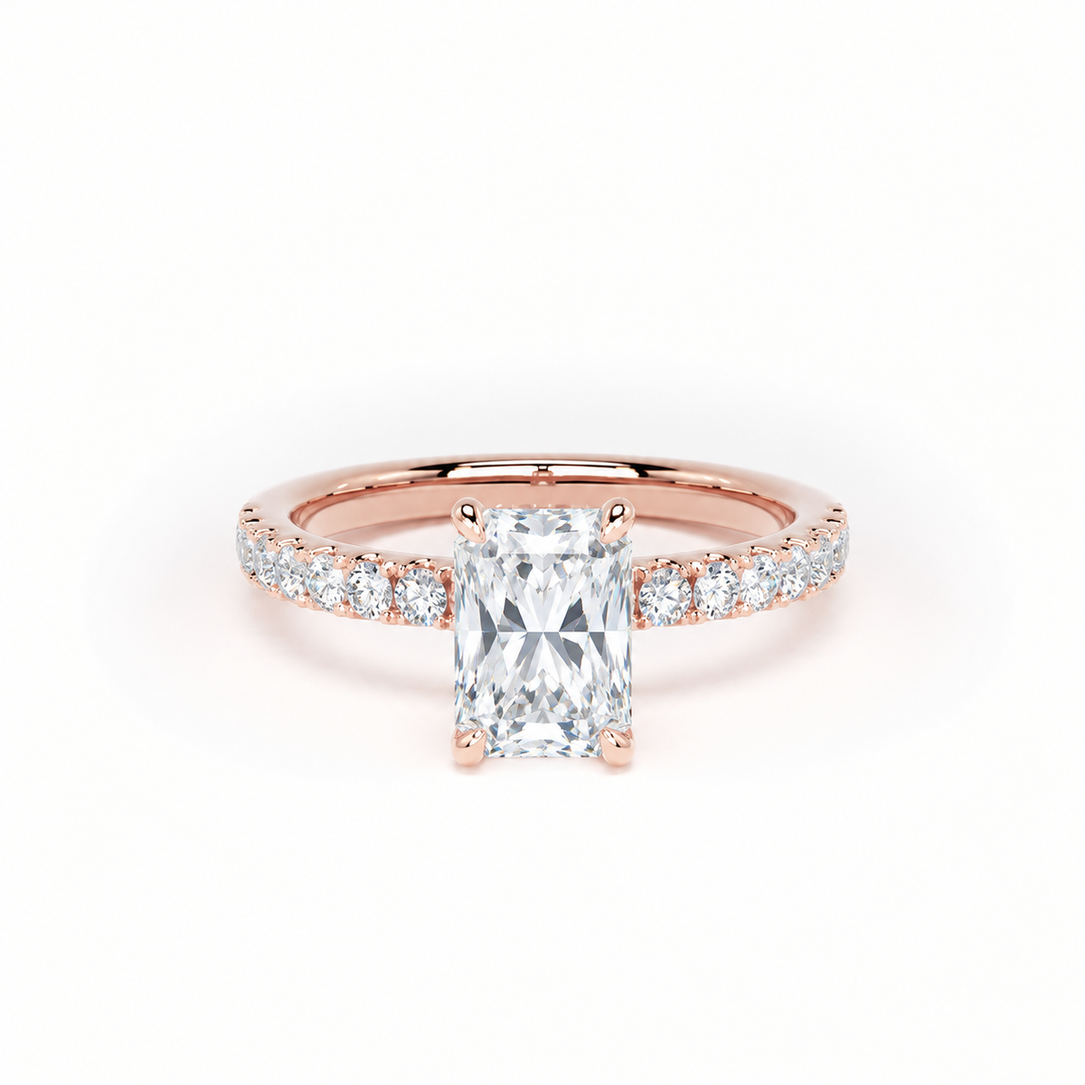 A rose gold engagement ring featuring a large rectangular radiant-cut diamond center stone and smaller diamonds set along the shoulders, shown on a clean white background.