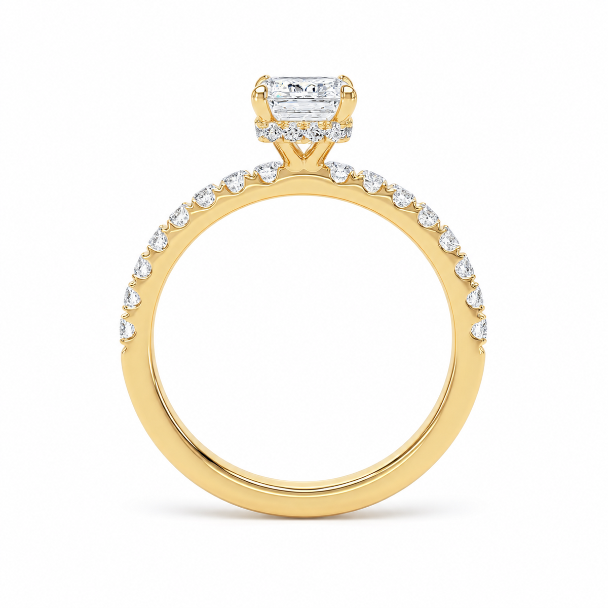 A yellow gold engagement ring featuring a rectangular radiant-cut diamond center stone and a pavé-set row of small diamonds along the band, shown on a clean white background.