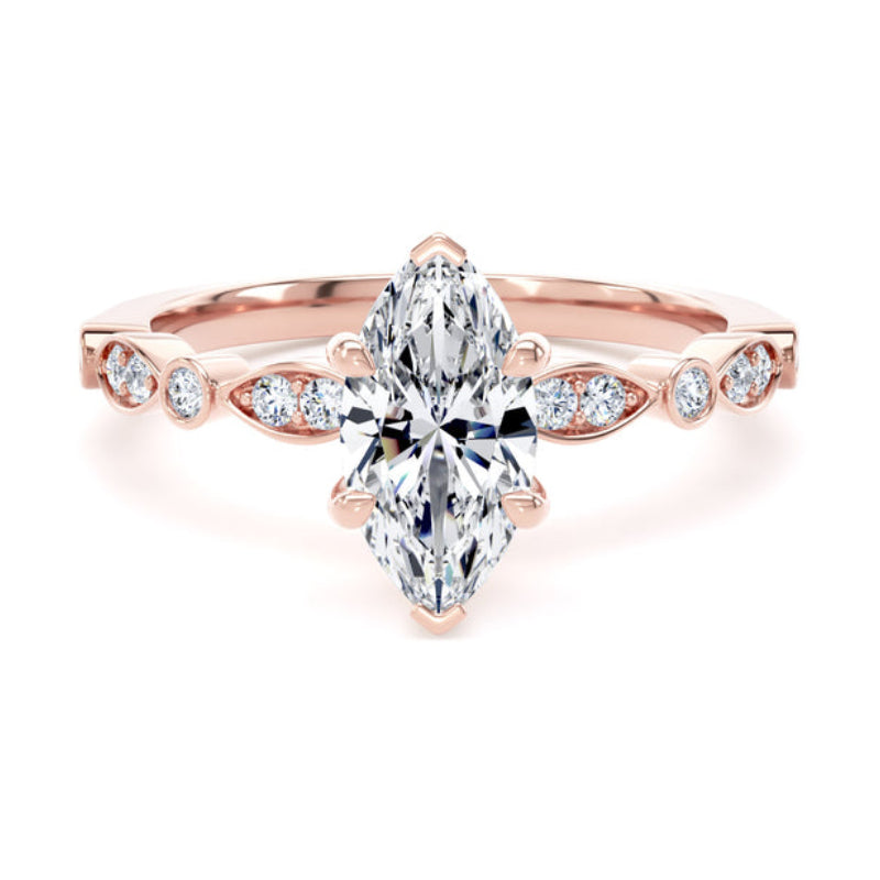 A rose gold ring featuring a marquise-cut diamond center stone and smaller diamonds along the band, set against a plain white background.