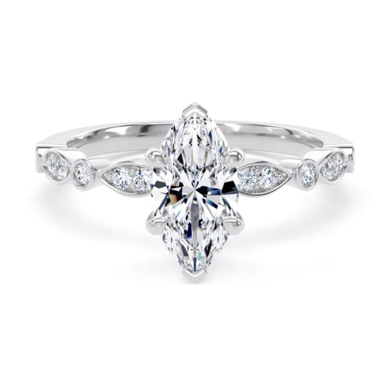 Diamond ring with a pear-shaped center stone on a white background