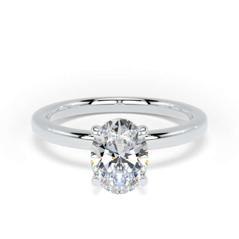 A classic solitaire engagement ring featuring a round brilliant-cut diamond set in a polished white gold or platinum band, shown on a clean white background.