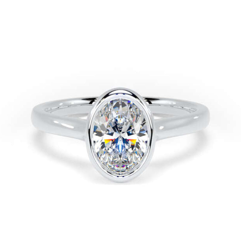 A silver oval solitaire engagement ring with a brilliant-cut clear center stone, set against a clean white background.