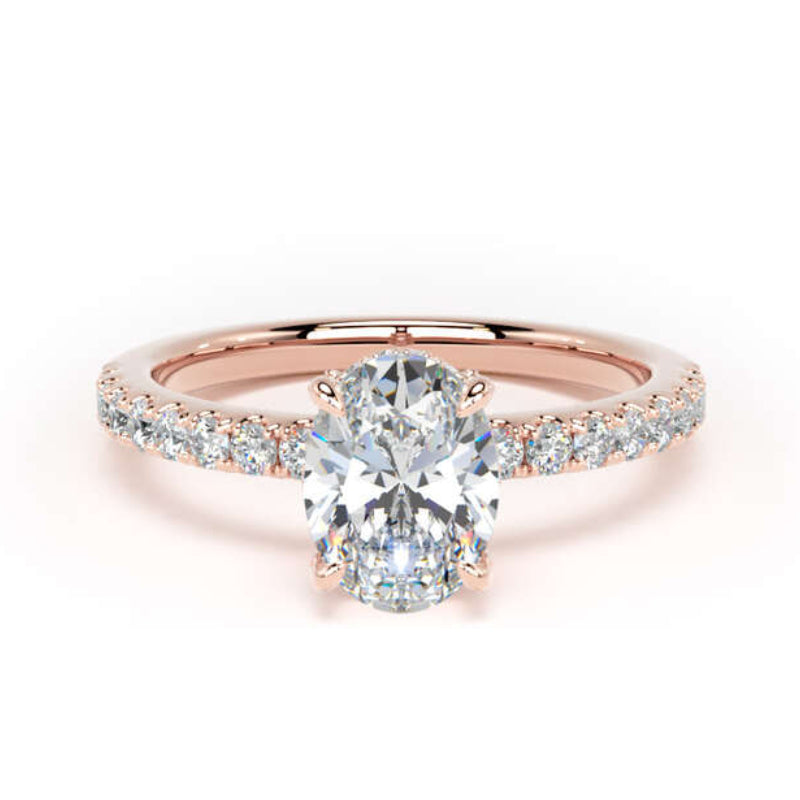 A rose gold engagement ring featuring a pear-cut center stone and a pavé-set diamond band, shown on a clean white background.