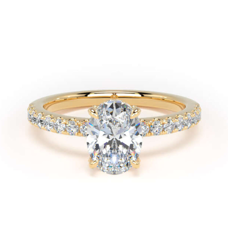 A yellow gold engagement ring featuring a large oval-cut center stone and a pavé-set diamond band, shown on a clean white background.